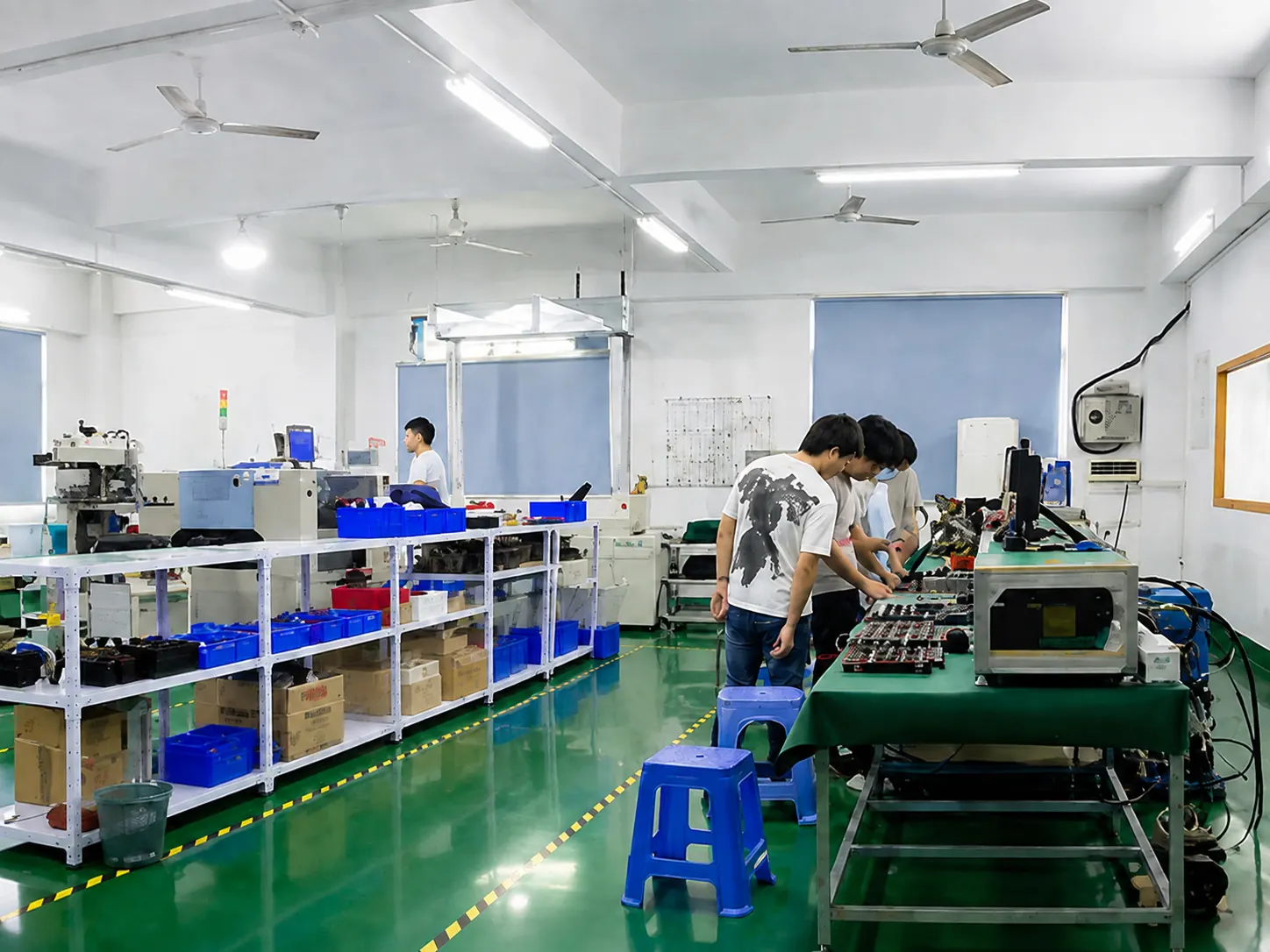 Technicians following a standardized transmitter assembly process